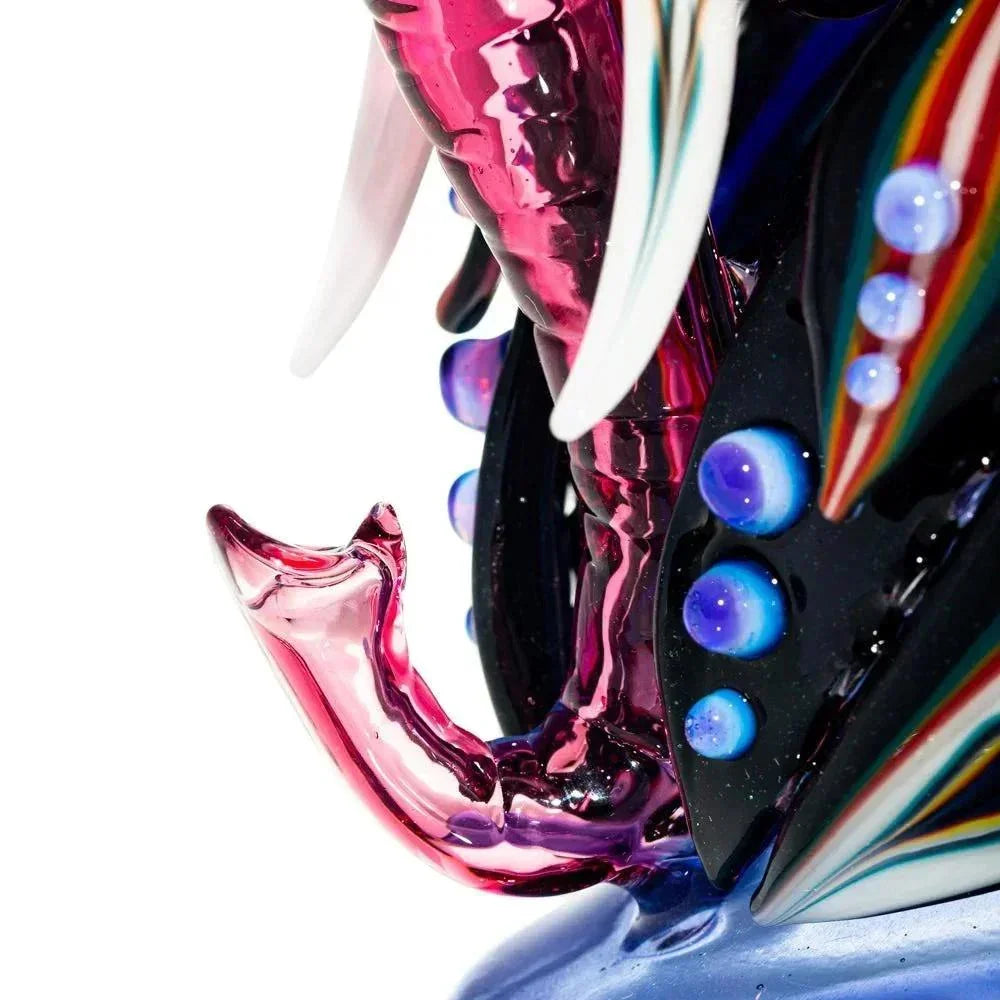 Close-up of a colorful glass recycler pipe with intricate details and vibrant accents.