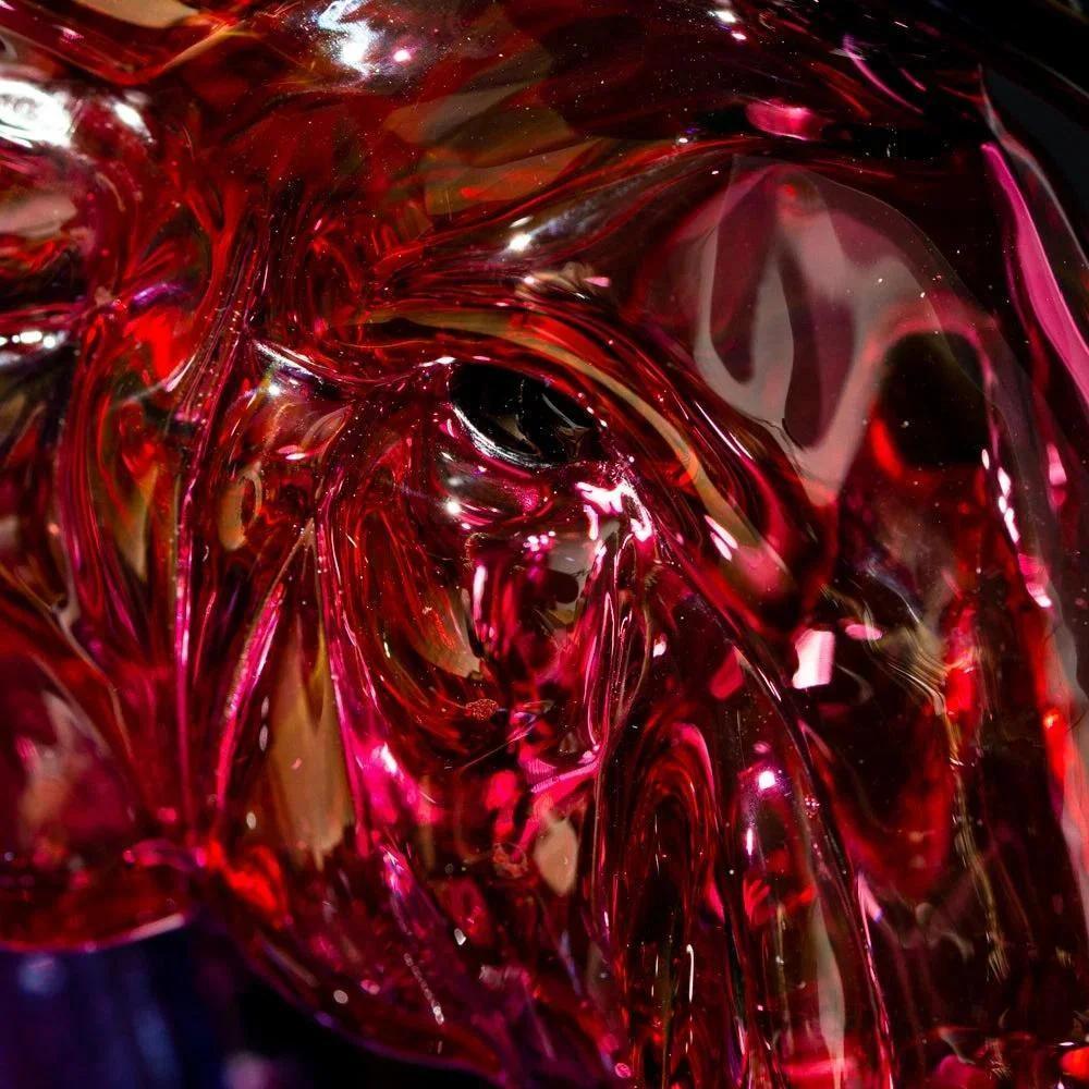 Close-up of red glass elephant recycler pipe showcasing intricate details and glossy finish