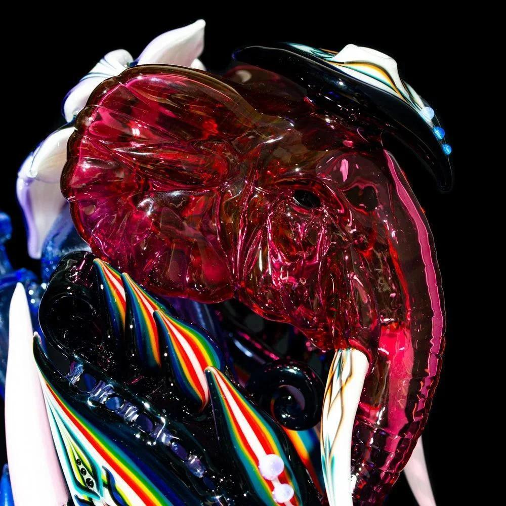 Colorful glass elephant recycler with vibrant rainbow accents and detailed tusks