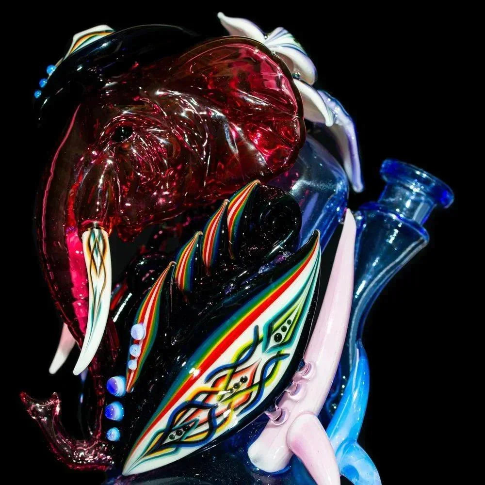 Intricate glass elephant recycler rig with colorful accents and detailed patterns