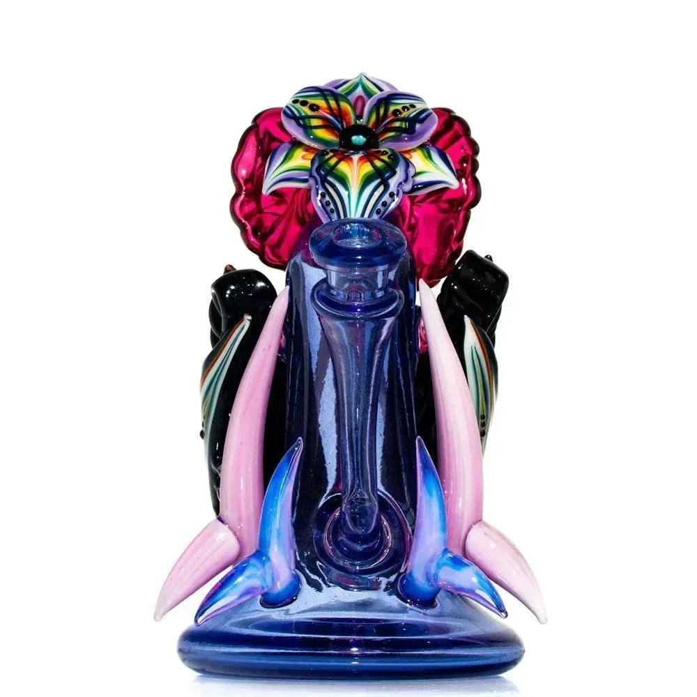 Colorful glass recycler rig with vibrant flower and horn accents, heady glass art piece.