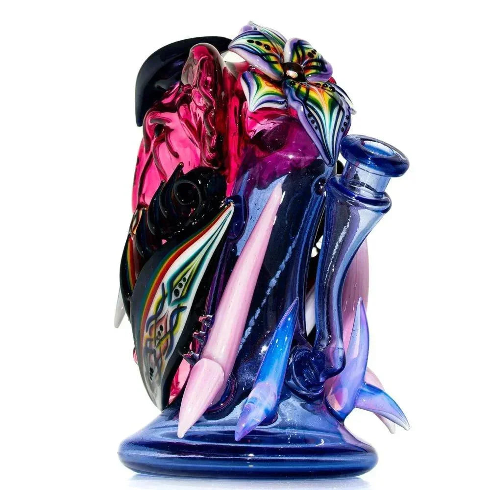 Colorful glass water pipe with floral accents and intricate patterns, heady glass art piece.