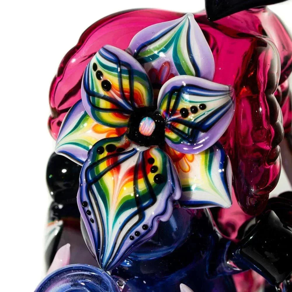 Close-up of colorful glass art flower on a handblown glass pipe