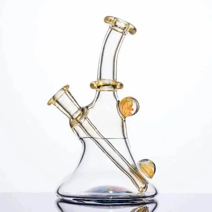 Clear glass bong with amber accents and dual chambers, ideal for heady glass collectors
