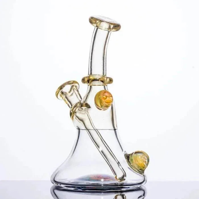 Clear glass bong with amber accents and dual chambers, ideal for heady glass collectors