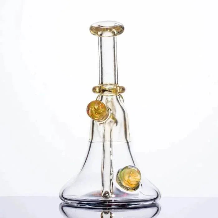 Clear glass bong with amber accents and dual side chambers, studio shot