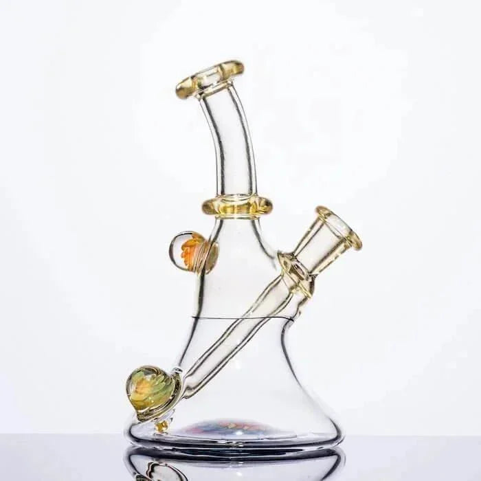 Clear glass bong with amber accents and dual chambers, ideal for heady glass collectors