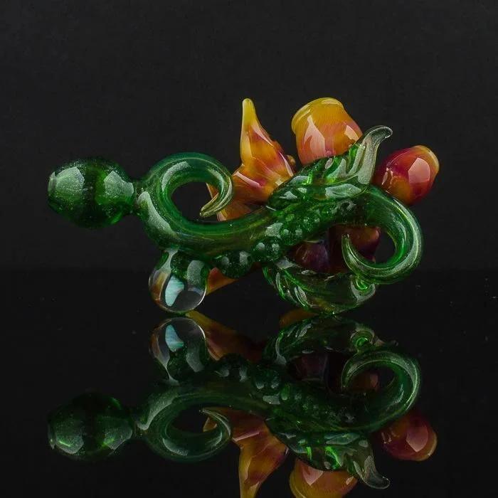 Hand-blown green glass pipe with floral accents, heady glass art for collectors