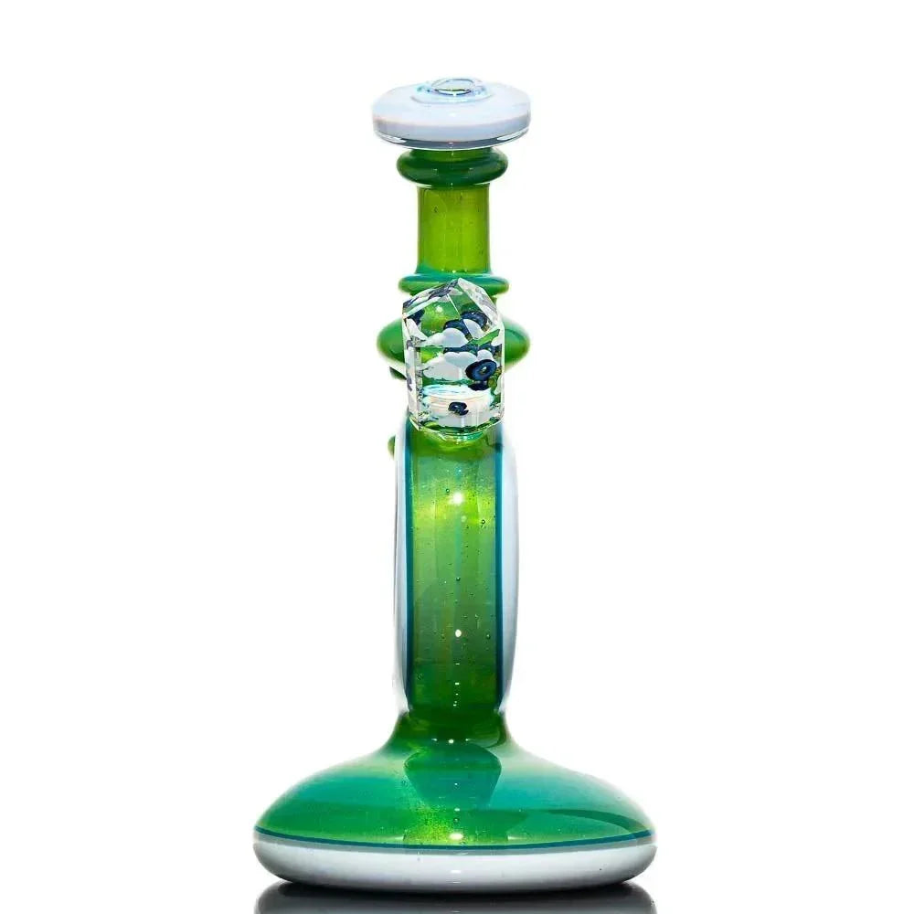 Green glass water pipe with white accents and faceted detail, displayed on white background.