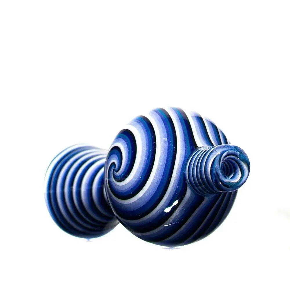 Blue and white glass bubble cap with spiral design, smoking accessory on white background