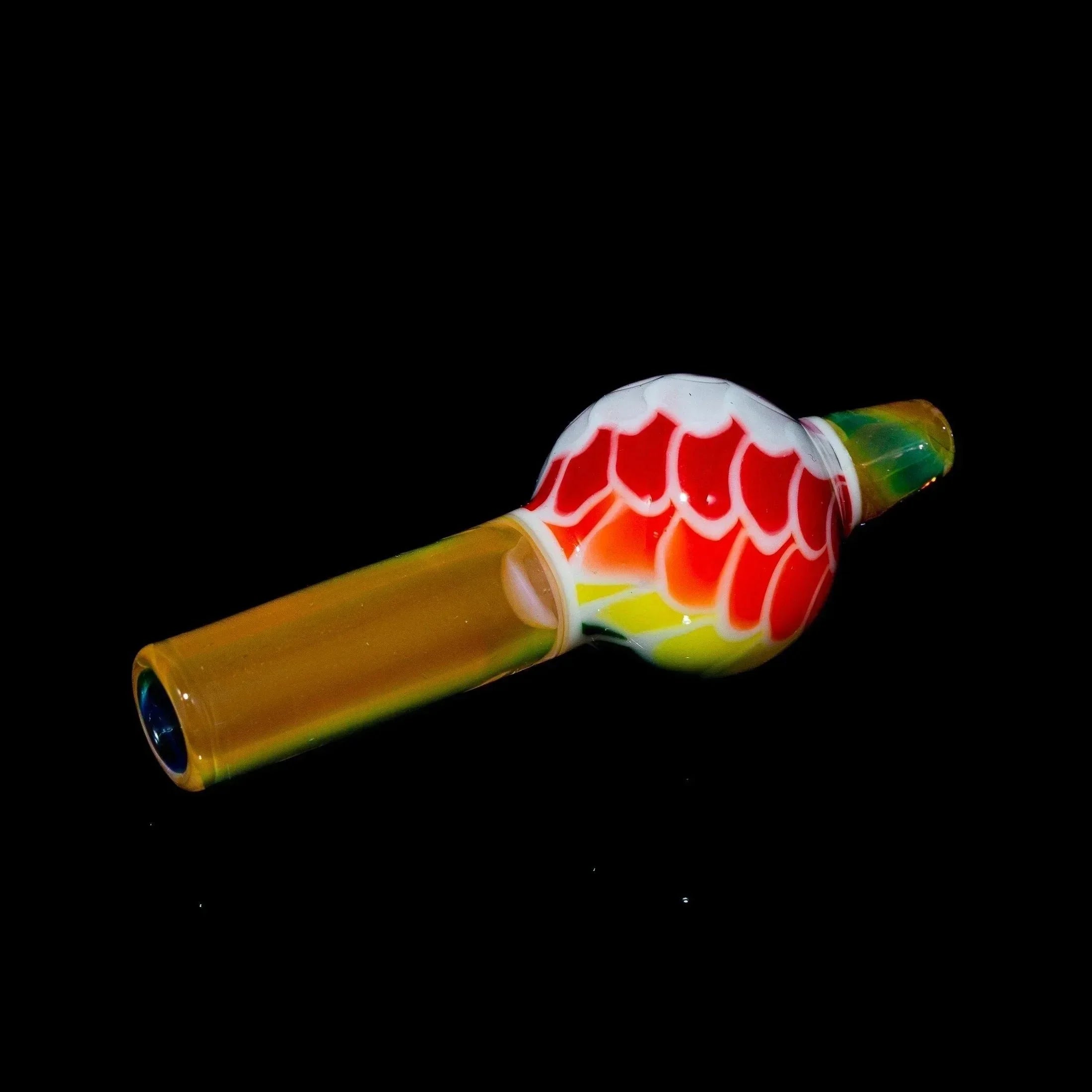 Colorful glass carb cap with rainbow scales design, used for dab rigs or water pipes