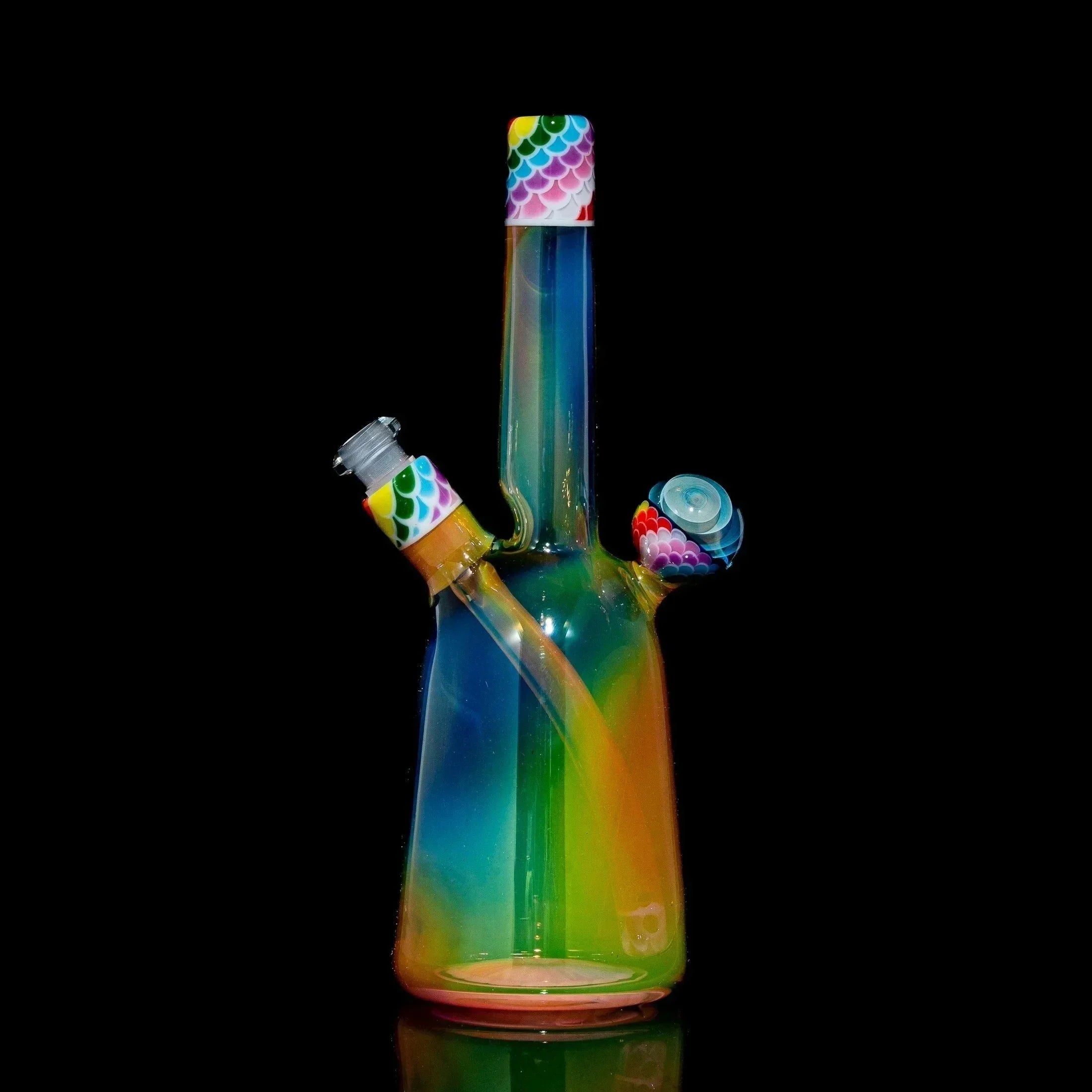 Rainbow glass rig with colorful dot patterns and matching sherlock cap set against black background