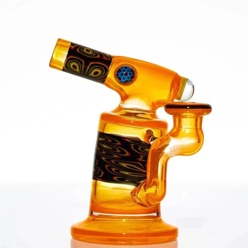 Amber glass mini water pipe with intricate patterns and bold design accents