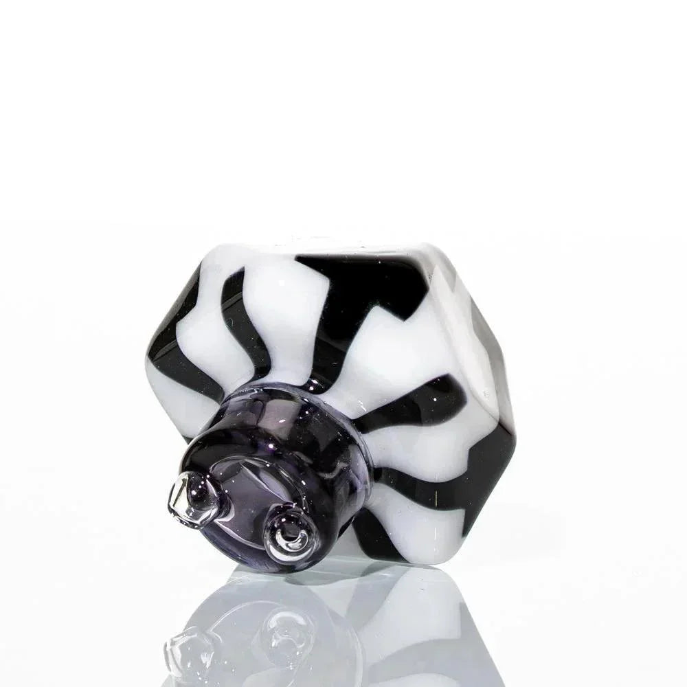 Black and white hexagonal glass carb cap with spiral design on a white background