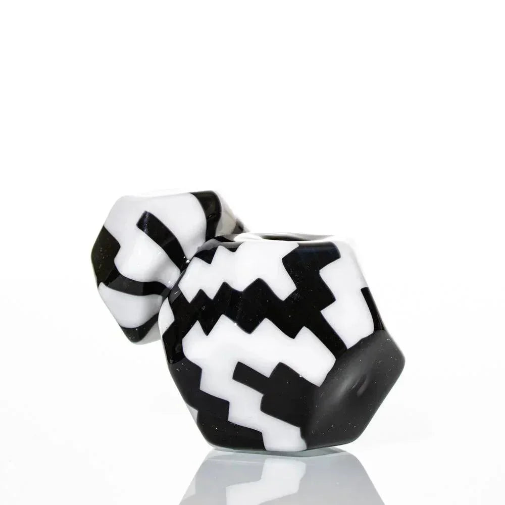 Geometric black and white glass pipe with zigzag pattern on a white background