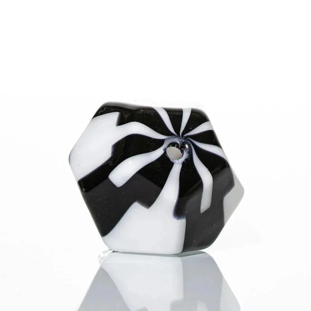 Hexagonal black and white glass carb cap with swirl pattern and central airflow hole