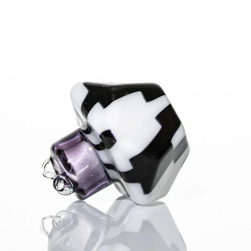 Black and white geometric glass carb cap with a purple base for dab rigs or water pipes