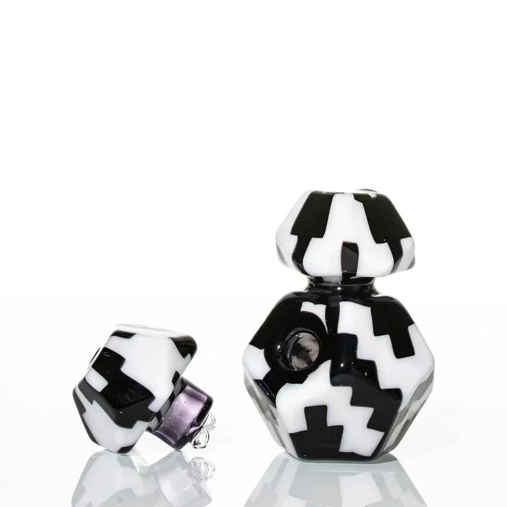 Geometric black and white glass hand pipe with bold zigzag patterns, modern design
