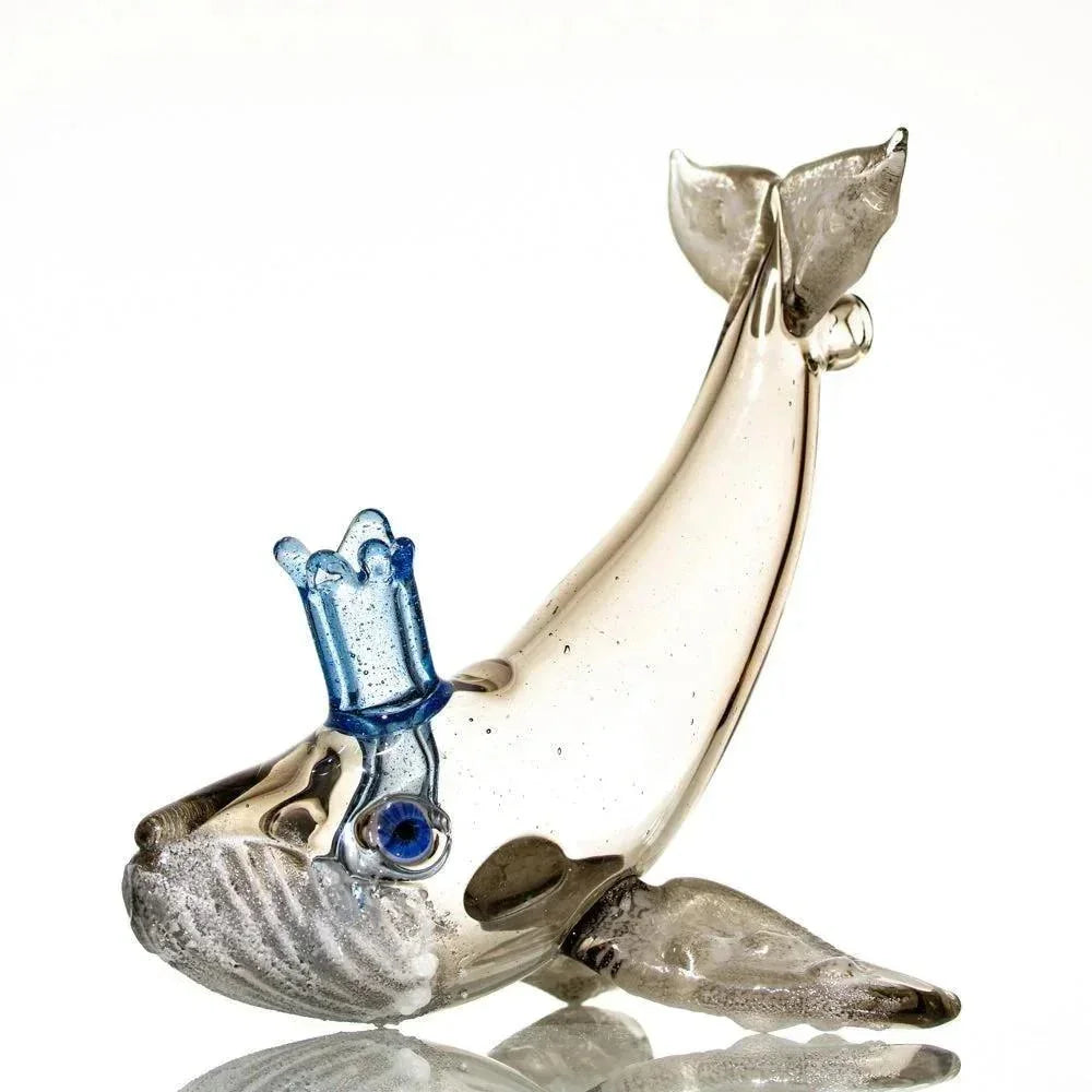 Handblown glass pipe shaped like a humpback whale with blue glass details