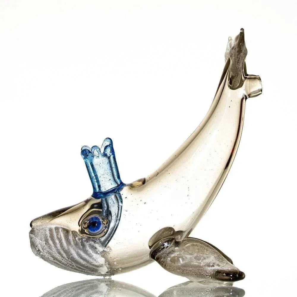 Handblown glass whale pipe with blue spout detail, displayed on white background.