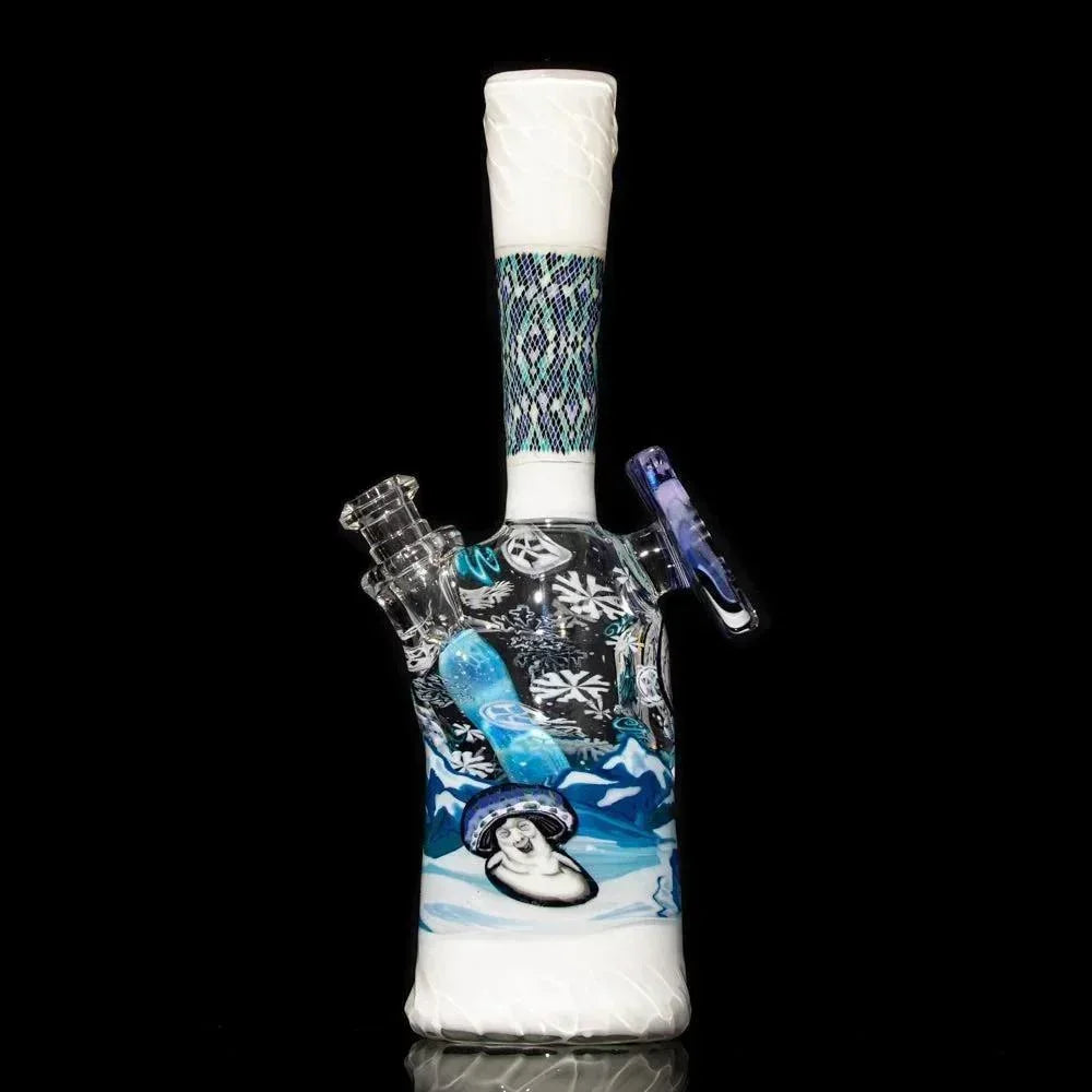 Heady glass water pipe with snowflake designs, blue accents, and winter landscape art