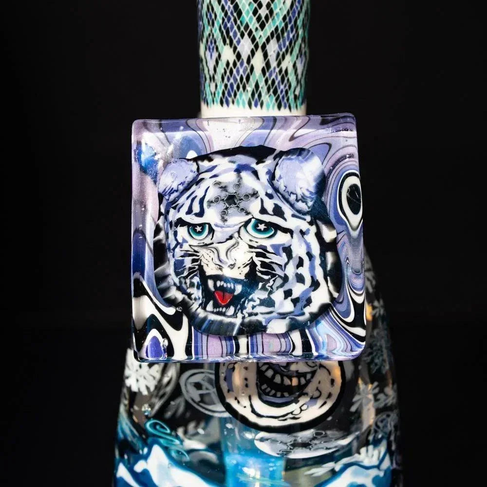 Heady glass pipe with intricate snow leopard face design, colorful patterns, and detail artwork