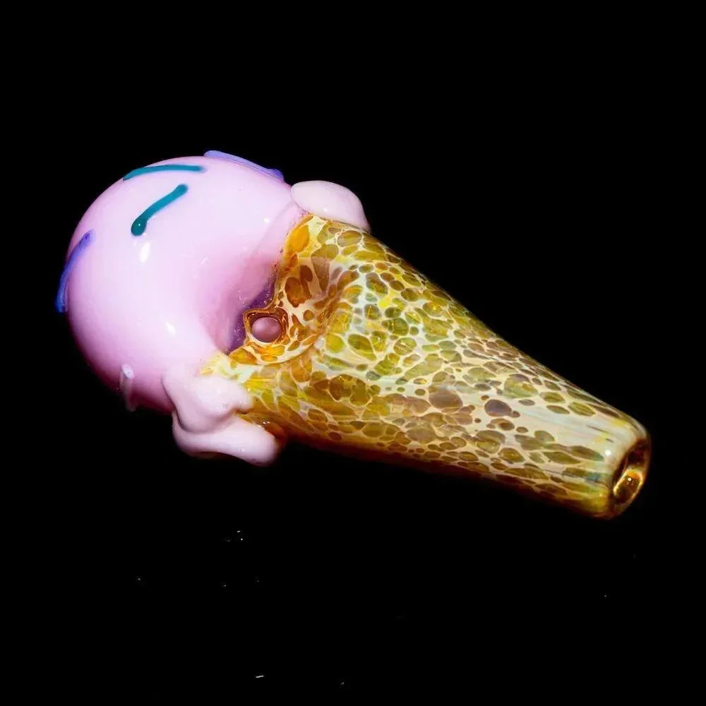 Handblown glass pipe shaped like an ice cream cone with strawberry scoop design