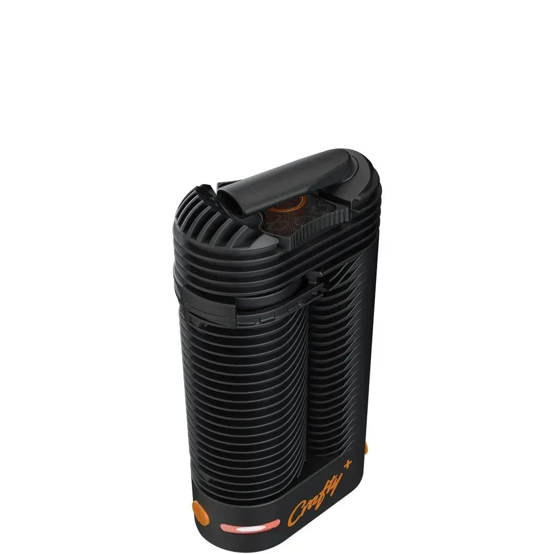Crafty+ portable black vaporizer with orange accents on a white background