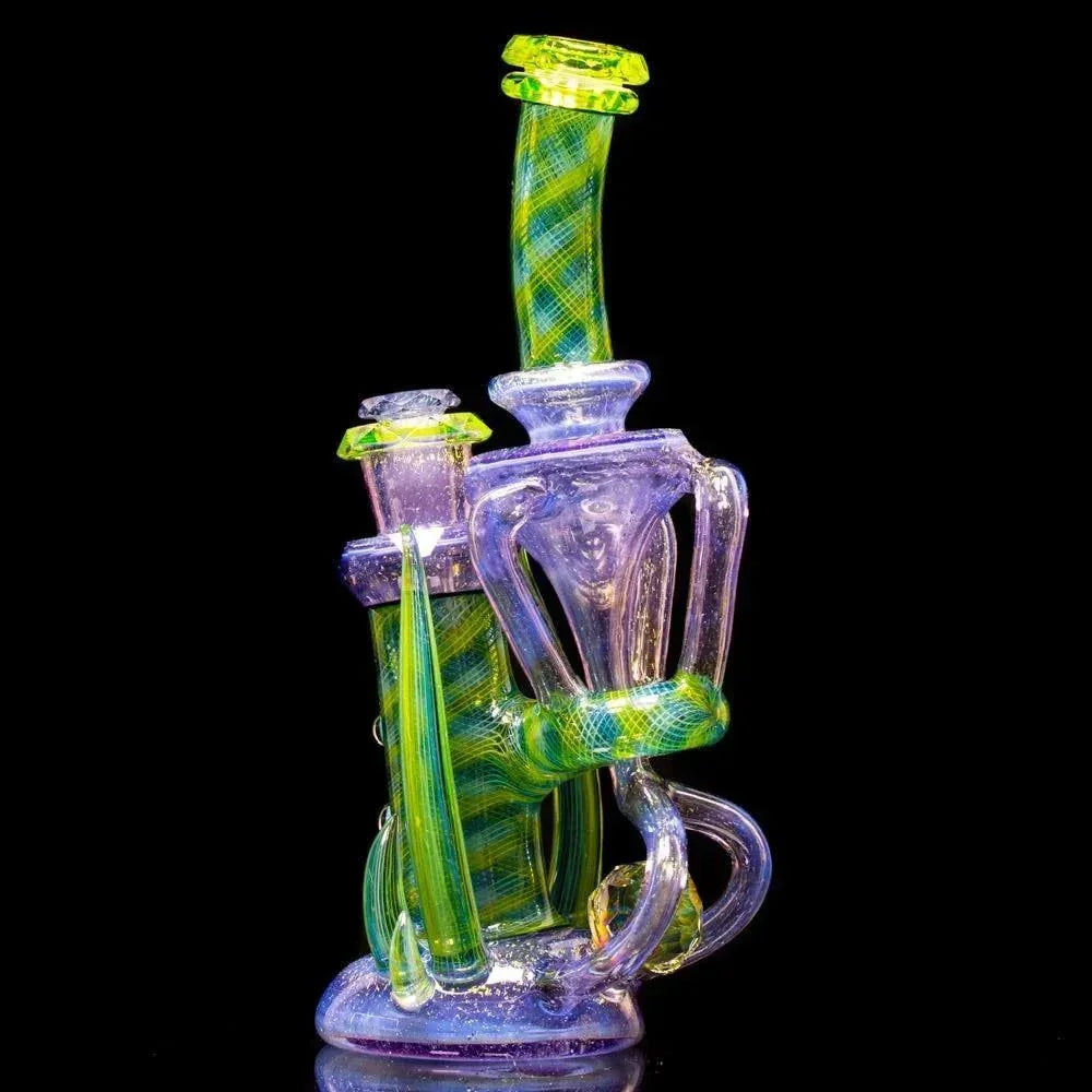 Colorful heady glass water pipe with intricate green and purple design on black background