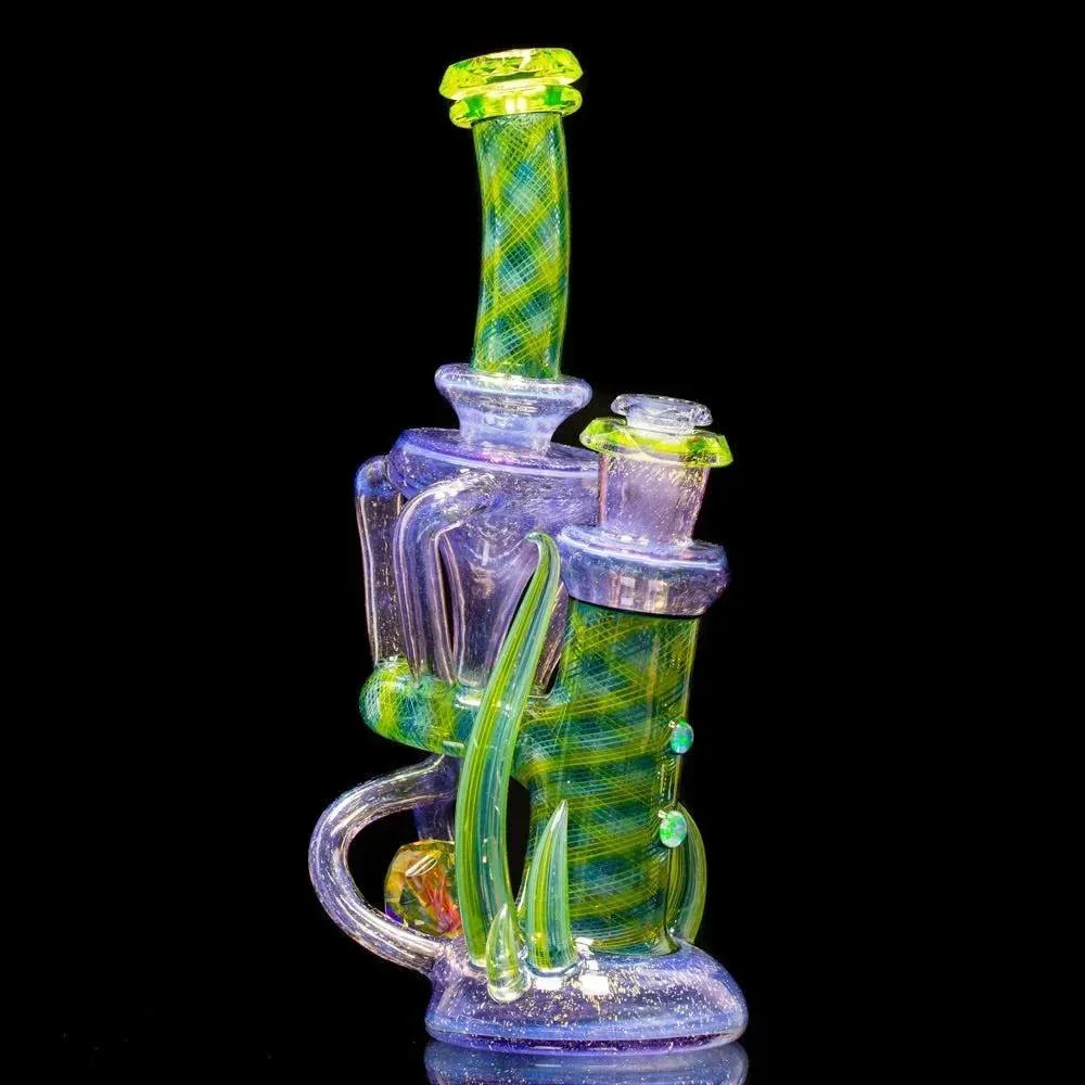 Intricate heady glass water pipe with green and purple dichroic patterns and artistic accents