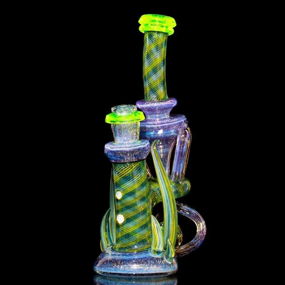 Heady glass water pipe with neon green accents and intricate swirling patterns on a black background.