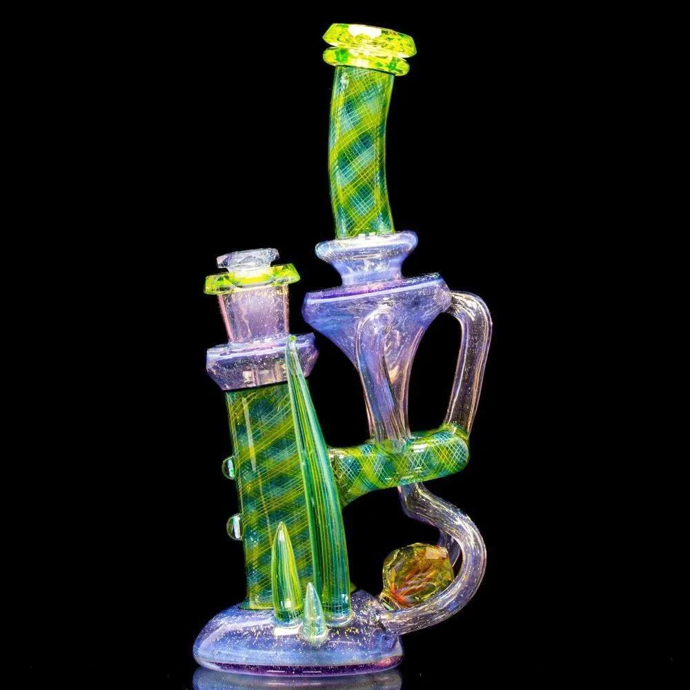 Colorful heady glass water pipe with intricate design and neon accents on a black background.