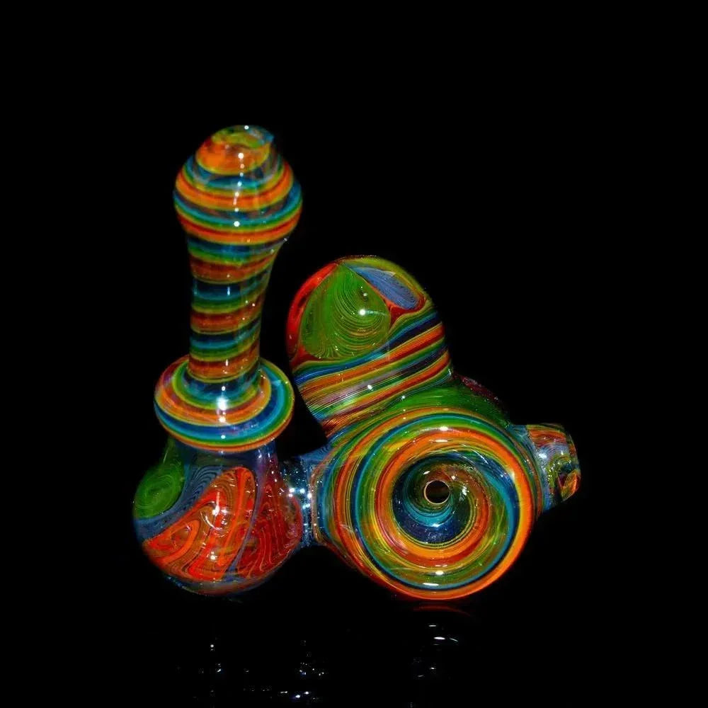 Colorful glass sidecar pipe with rainbow linework design on black background