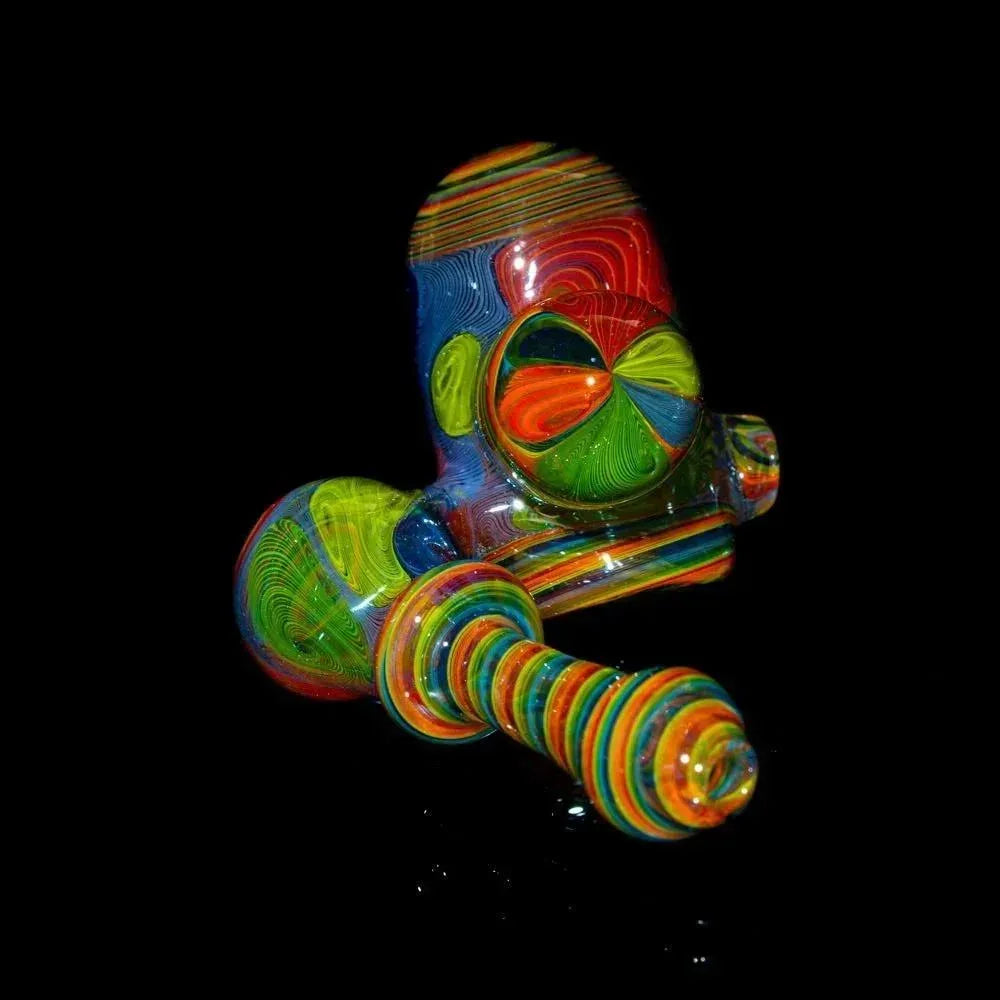 Colorful hand-blown glass sidecar pipe with vibrant linework on a black background.