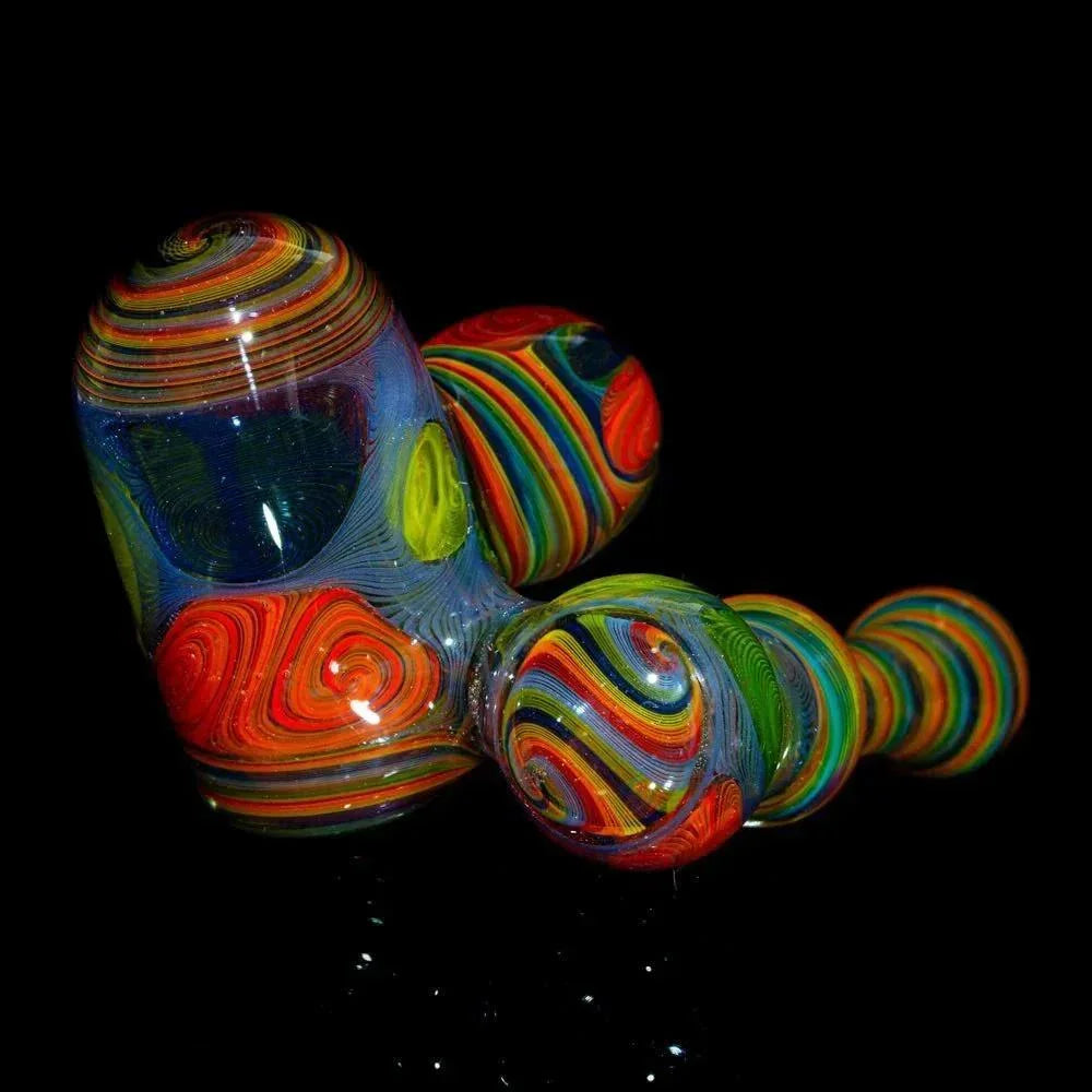 Colorful glass sidecar pipe with intricate rainbow swirl patterns on a black background.