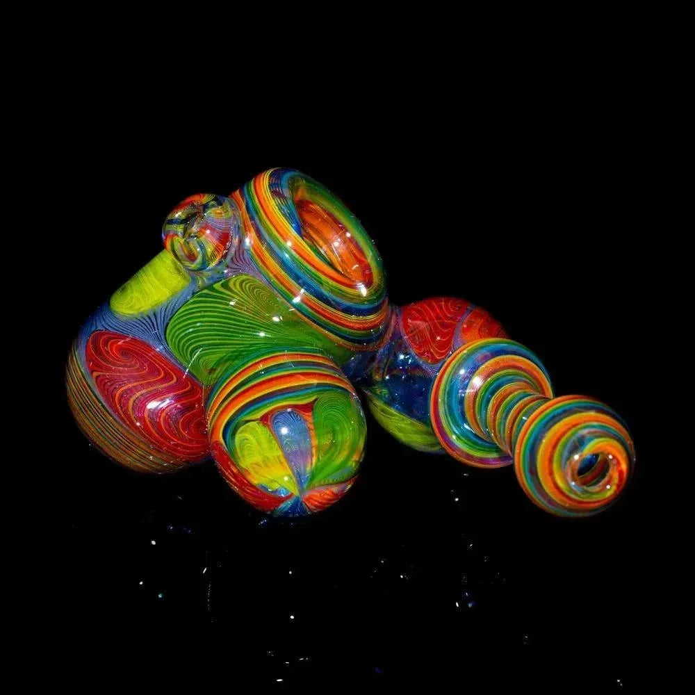 Colorful hand-blown glass sidecar pipe with intricate rainbow swirl patterns on black background.