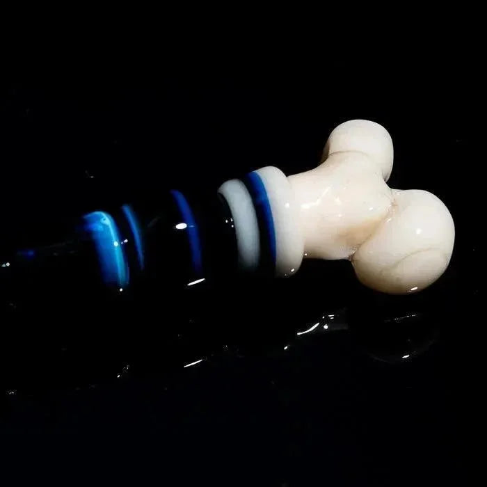 Hand-blown glass pipe with blue and white swirls, bone-shaped mouthpiece, heady glass art