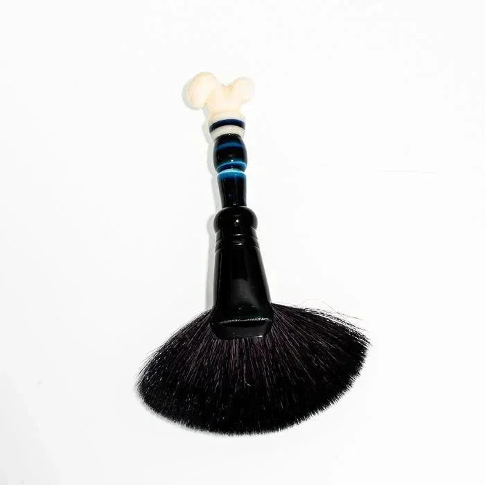 Black glass dab brush with bone-style handle and blue accents, ideal for heady glass accessories