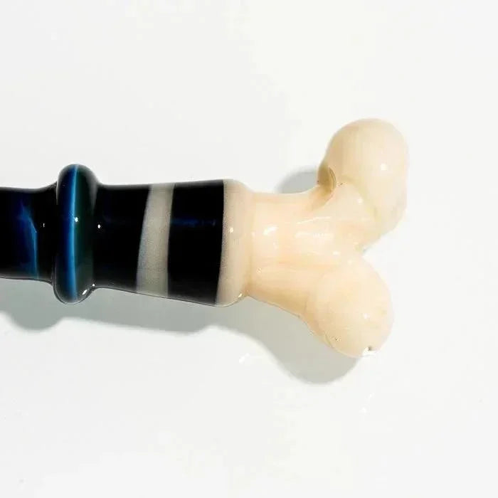 Handblown glass pipe with bone-shaped mouthpiece, blue and black striped stem, heady glass art