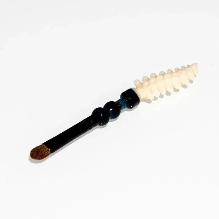 Black glass pipe with spiral design and brush tip for cleaning