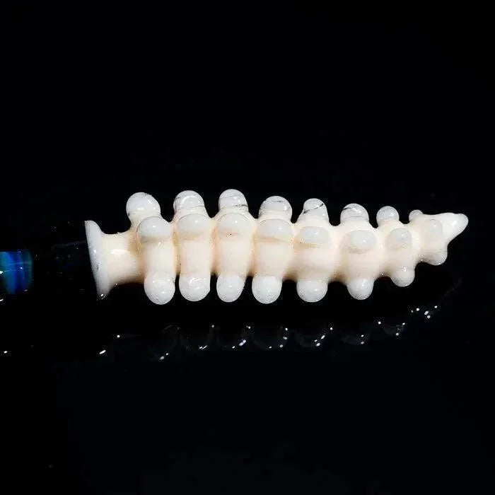 Heady glass pipe with spine-like design, glossy white finish, and reflective surface