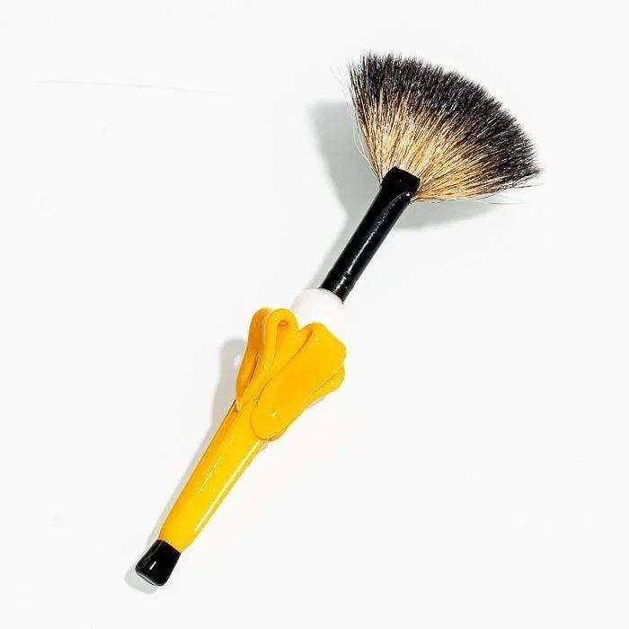 Yellow-handled cleaning brush with black and tan bristles for glass pipes and vaporizers