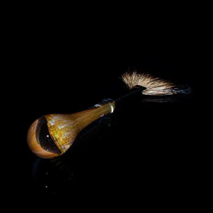 Handcrafted heady glass pipe with intricate mosaic design and feather accent