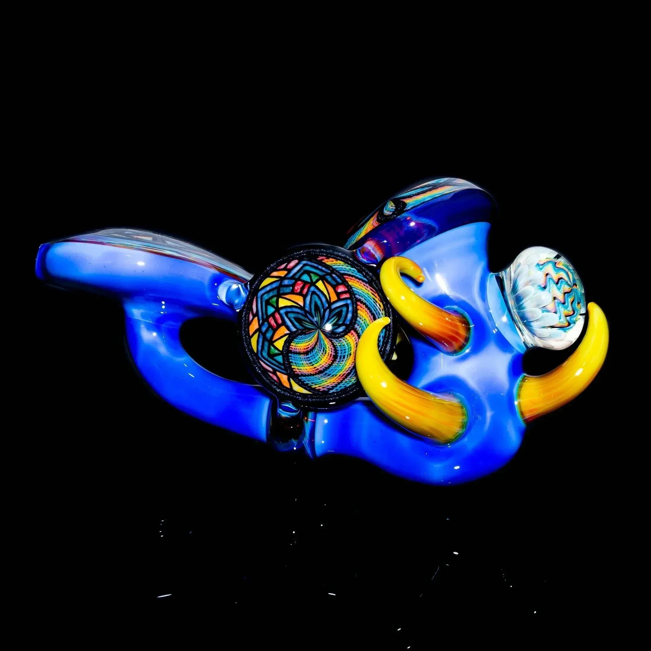 Colorful glass sherlock pipe with intricate lattice patterns and vibrant yellow accents