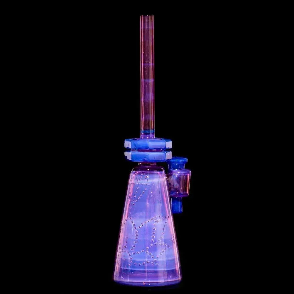 Colorful glass water pipe with pink and blue accents on a black background