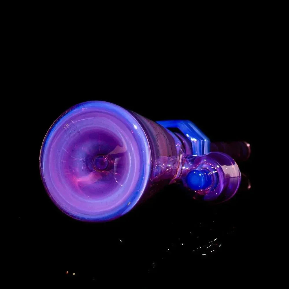 Purple and blue iridescent glass pipe or water pipe on black background, viewed from bottom