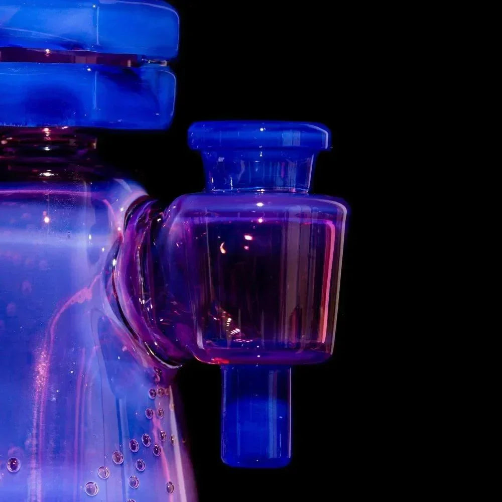 Close-up of colorful borosilicate glass water pipe with vibrant blue and purple accents