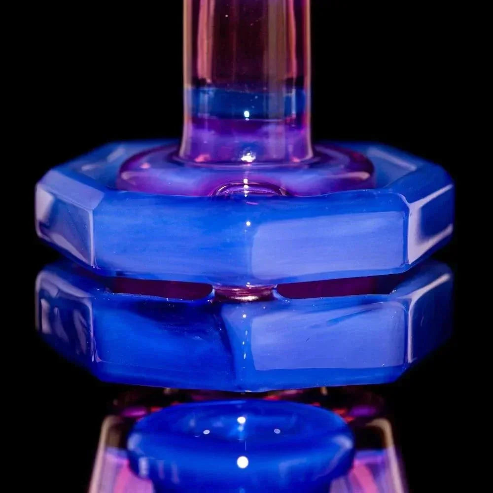 Close-up of blue and purple heady glass water pipe with geometric accents