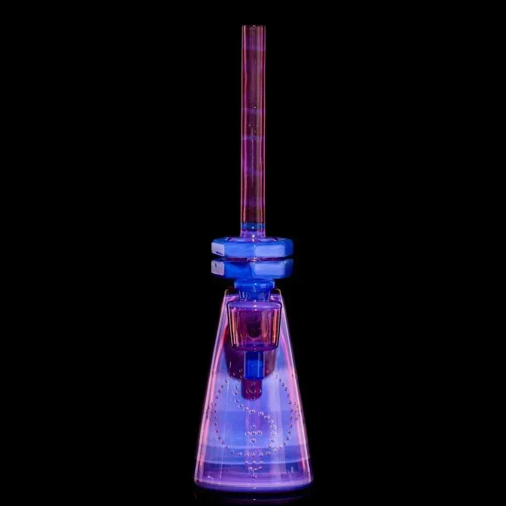 Iridescent pink and blue glass water pipe with beaker base on black background