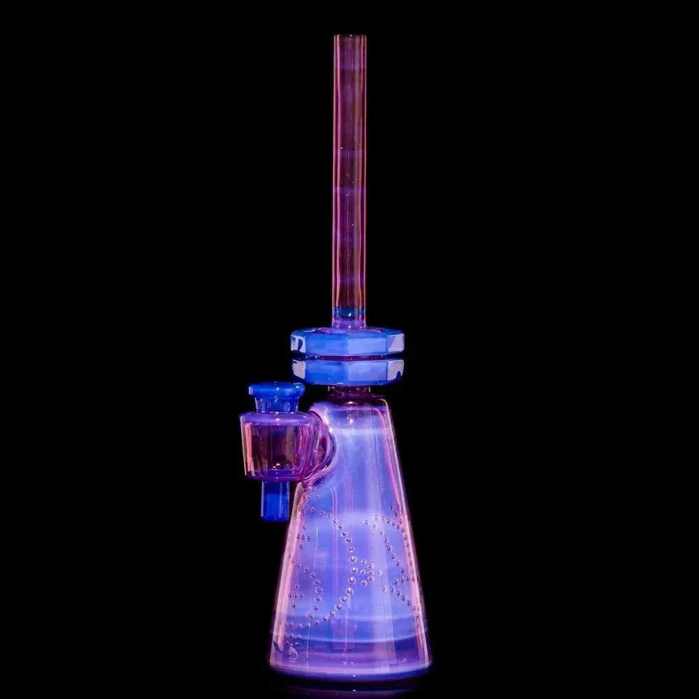 Colorful glass water pipe with bubble accents on black background